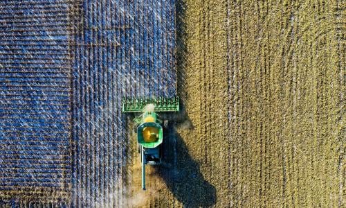 A birds eye view of a tractor on a field.
