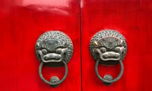 red door with luck dragons