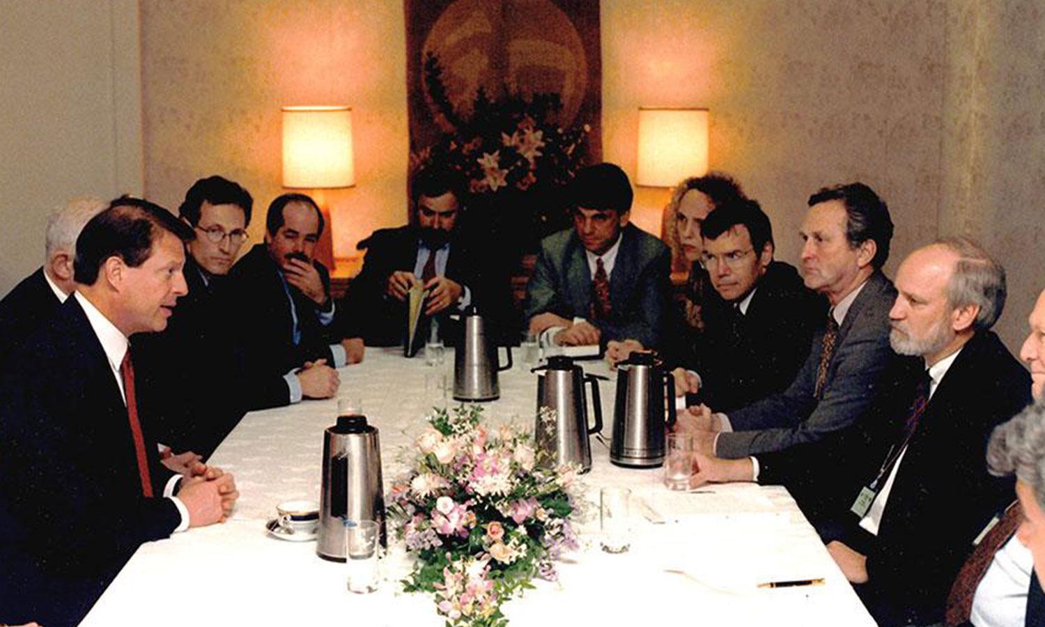 COP 3 members seated at table in Kyoto