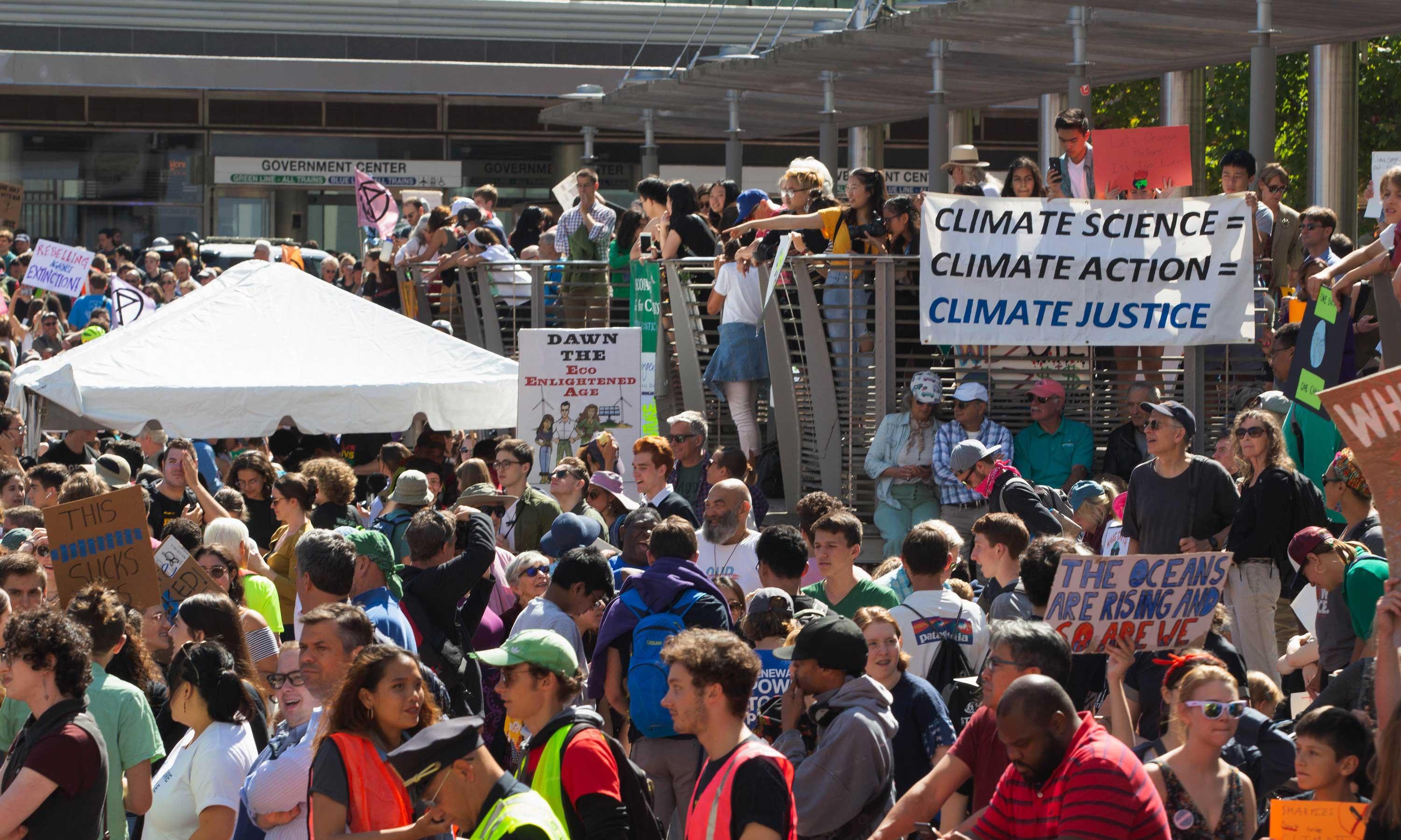 Climate activisists with science banner at protest