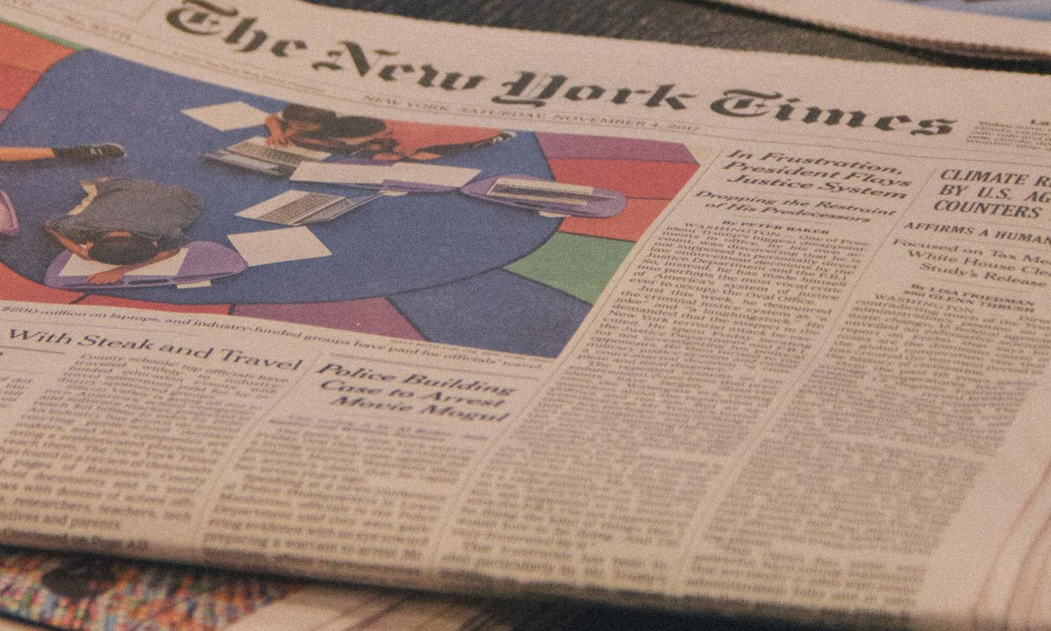 A newspaper on a table.