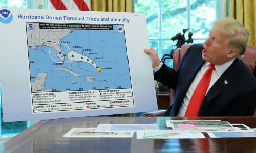 President Trump holding up a doctored hurricane map
