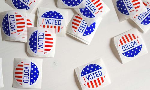 voting stickers on a white table