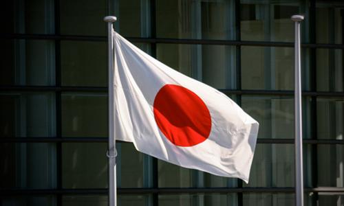Japanese flag in front of office building