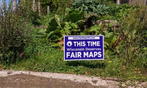 A yard sign promoting fair maps