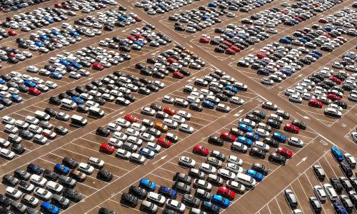 Aerial view of cars and trucks in parking lot