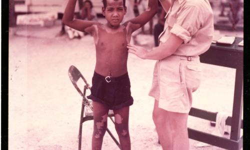 Dr. Conrad Examines Native Boy on Kwajalein