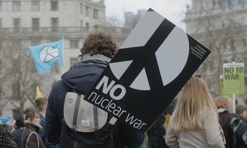  A man at a rally on London's Trafalgar Square with a sign, ‘No Nuclear War’, campaigning for nuclear disarmament, in support for the Ukrainian people at war.