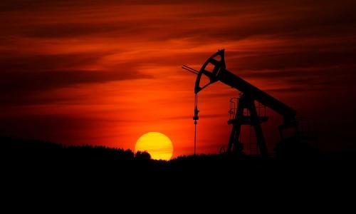 pump jack mining crude oil with sunset