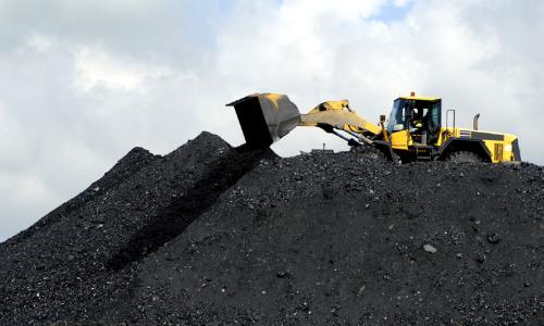 A front end loader working with coal