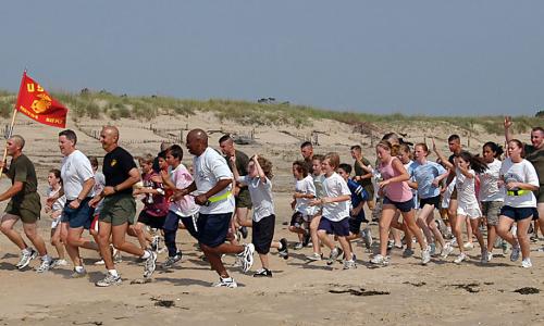 group running on the beach